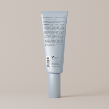 Blue tube of cream with label on a beige background