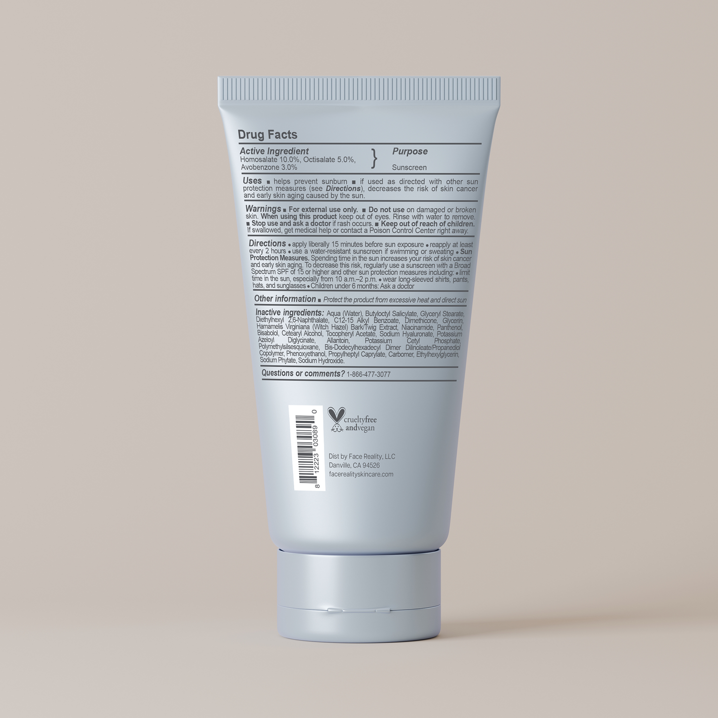 Back view of a blue sunscreen tube with text on a beige background