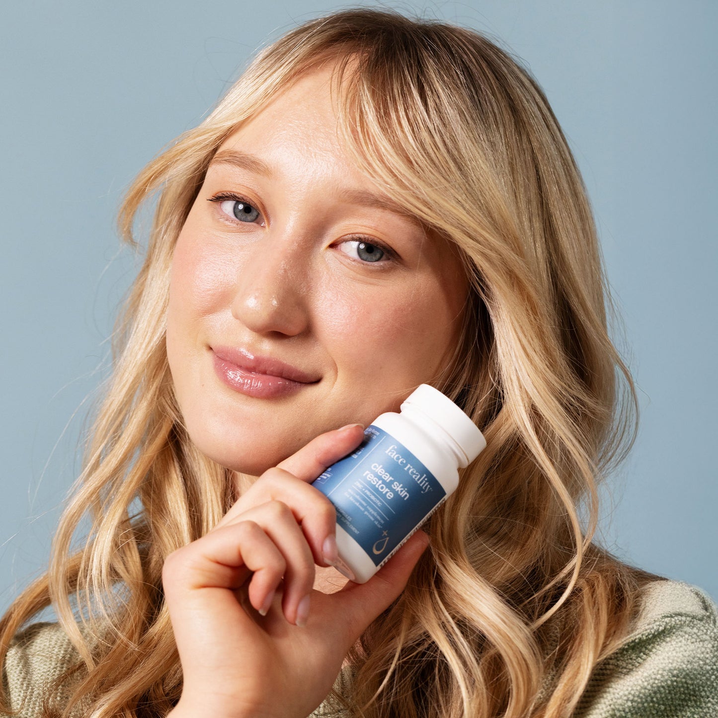 Face Reality ClearSkin Restore product with client