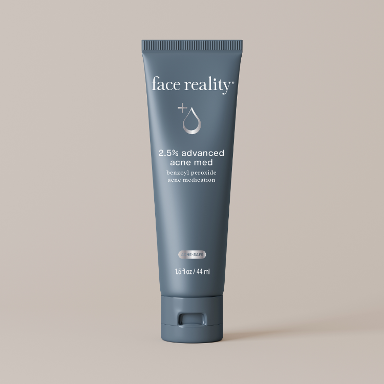 Tube of face reality 2.5% advanced acne med on a beige background