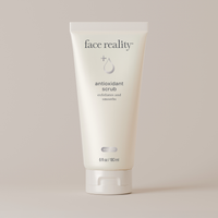 Tube of face reality antioxidant scrub on a light background