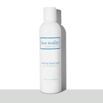 White six ounce bottle of Face Reality Calming Facial Toner in front of a white background on a grey surface  - view 1
